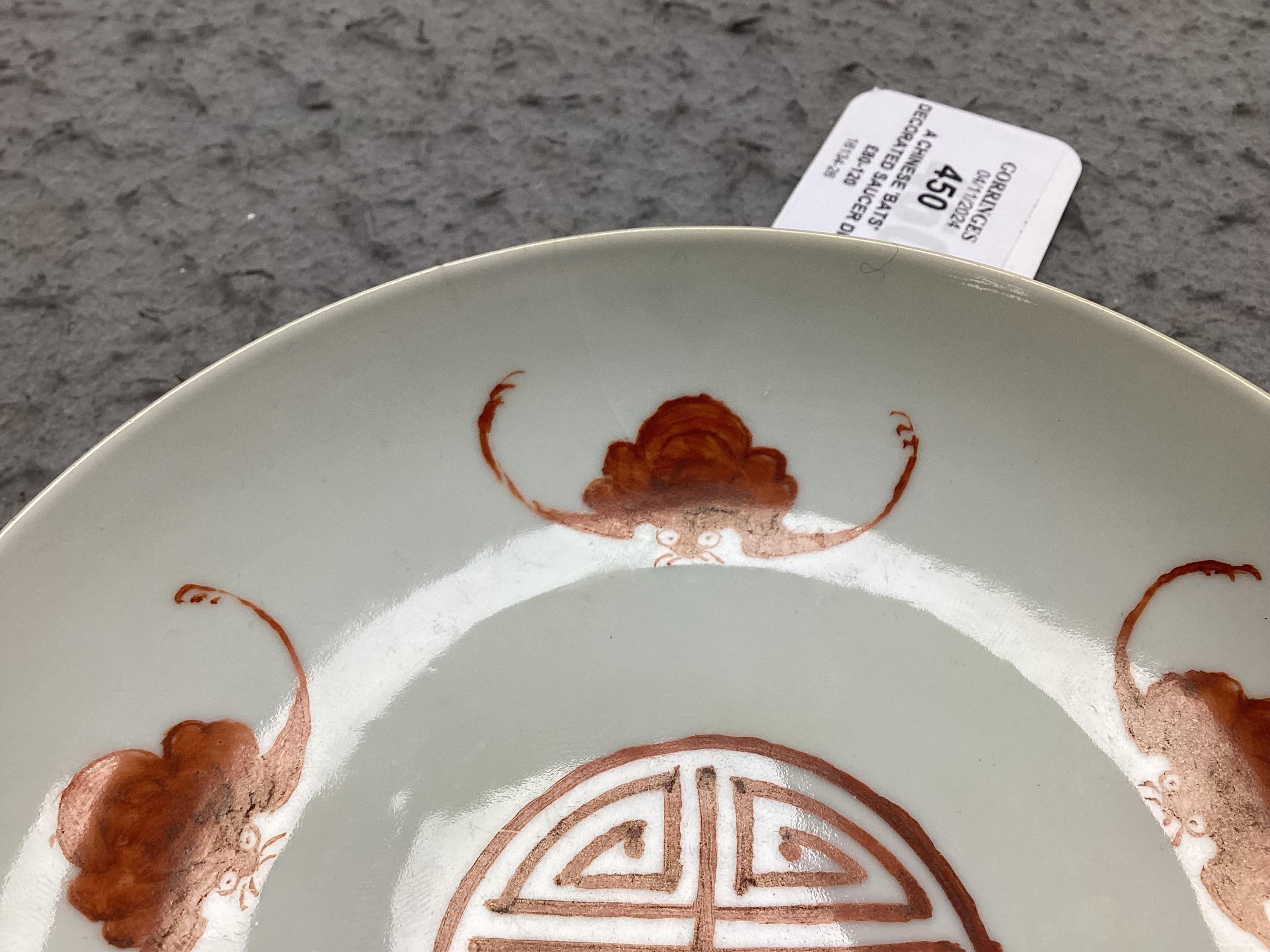 A Chinese ‘bats’ decorated saucer dish, Tongzhi mark and period, later decorated, 15cm in diameter. Condition - fair, stable but with hairline cracks